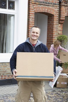 Packing boxes and wrapping household items for a Camden move