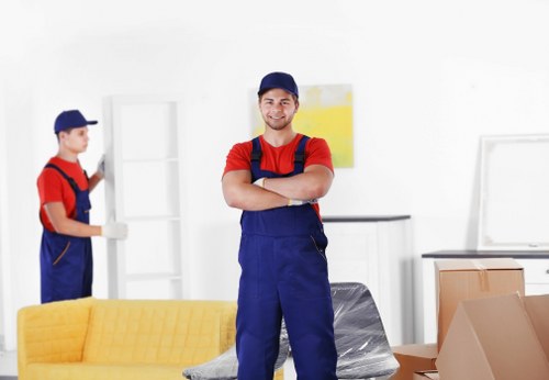 Removal team loading furniture for a Camden home move