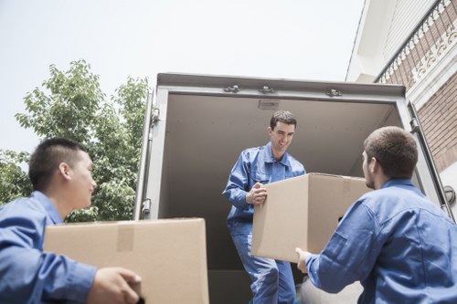 Careful piano transport through a Camden residential property with narrow access