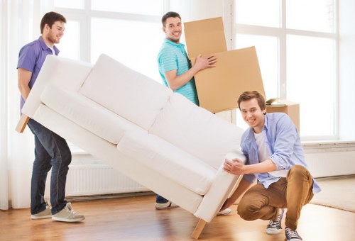 Sorted donation boxes and reusable furniture ready for charity partnership collection