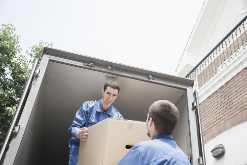 Van service navigating busy streets near Camden with boxes