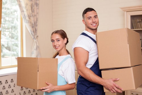Careful loading of boxed belongings into a removal van in Camden