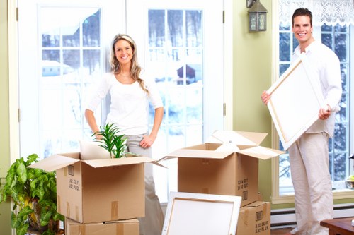 Camden moving team loading furniture into a van on a residential street