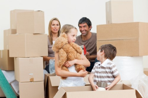 Packed household boxes and furniture ready for relocation in Camden