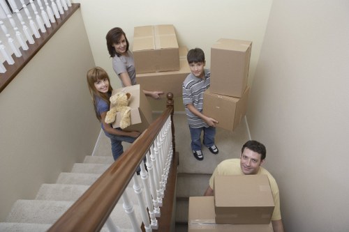 Boxes and furniture being loaded into a removal van